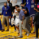 Jamal Murray #27 of the Denver Nuggets is helped off the court after an injury in their game against the Golden State Warriors at Chase Center on April 12, 2021 in San Francisco, California.
